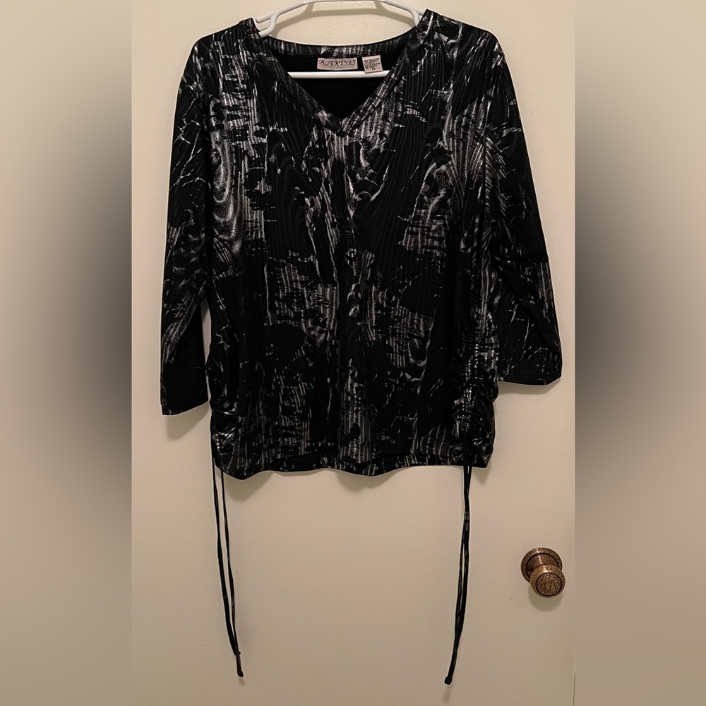 Woman’s blouse, 95% Polyester, 8% spandex, and the brand is Kaktus